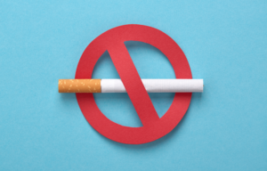 Illustration of a cigarette crossed out with a red no-smoking symbol